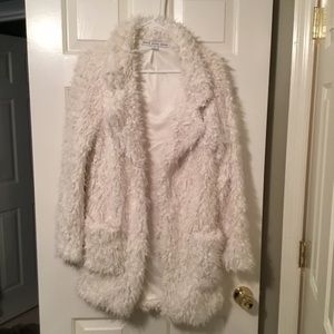 White furry jacket
